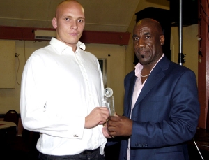 Dean Marney collects the Player of the Season Award on behalf of Wayne Walters 